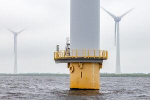 Offshore windfarm near Dutch coast with cloudy sky